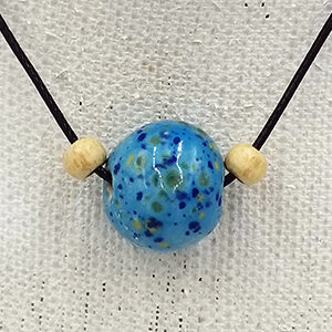 Close up of large bead blue speckle pottery necklace